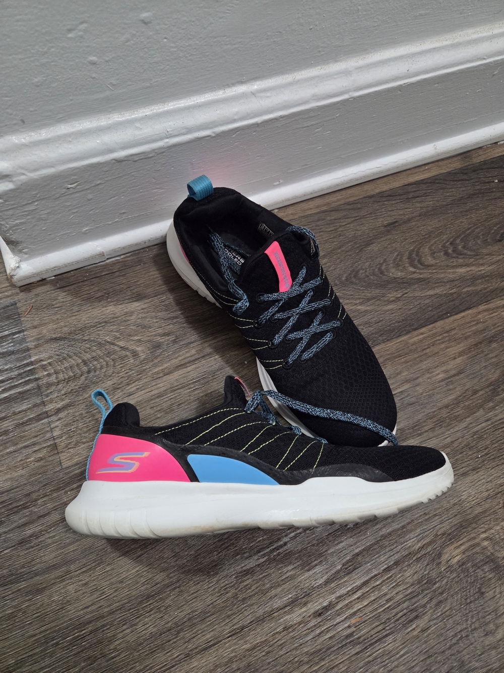 Skechers Size10 Women's Black Slip-On Athletic Sneakers with Pink & Blue Accents